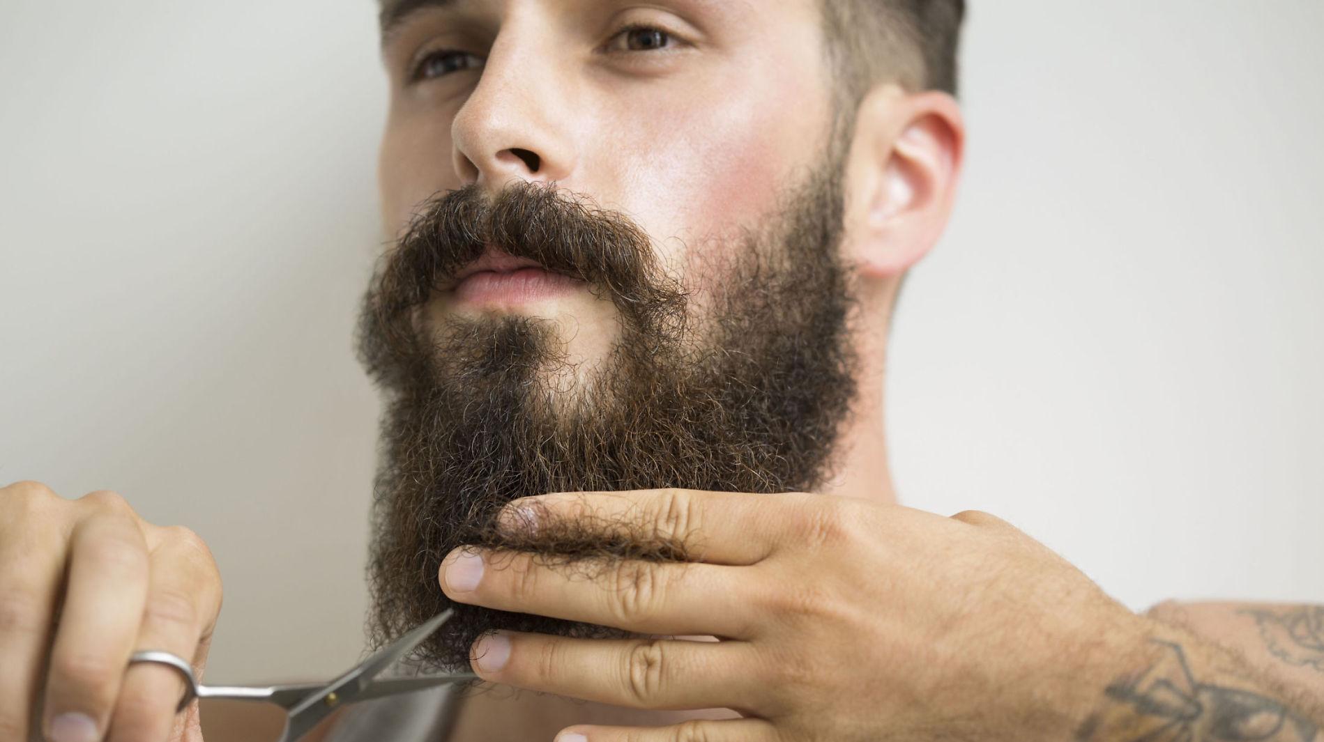 TRIMIMING: Store skjegg kan føles varmt og kløende når temperaturen ute stiger. Foto: Getty Images