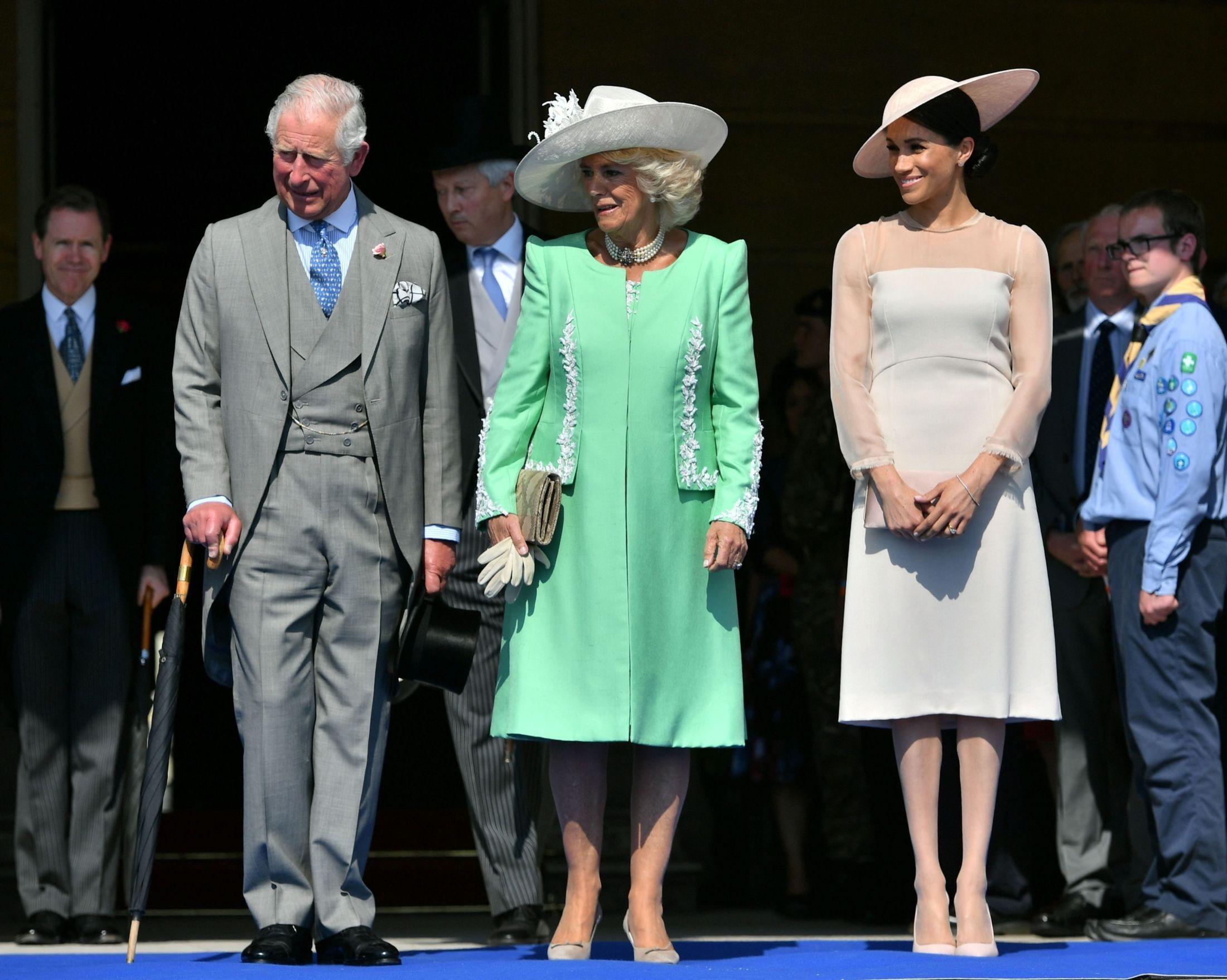 MED BURSDAGSBARNET: Her er Meghan Markle (t.h.) sammen med Camilla Parker Bowles og jubilanten prins Charles. Foto: AFP.