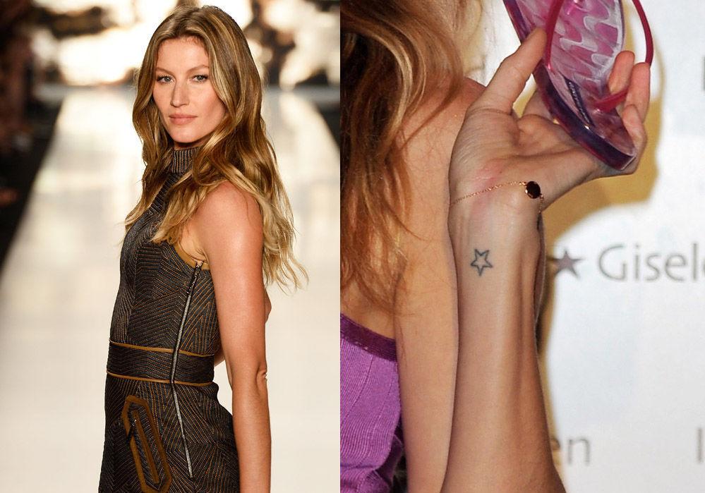 NESTEN USYNLIG: Det er nok ikke tilfeldig at modell Giselle Bündchen har valgt en knøttliten tatovering som er strategisk plassert på innsiden av håndleddet - da trenger den ikke å synes på catwalken, men kun når Giselle løfter armen. Foto: Getty Images