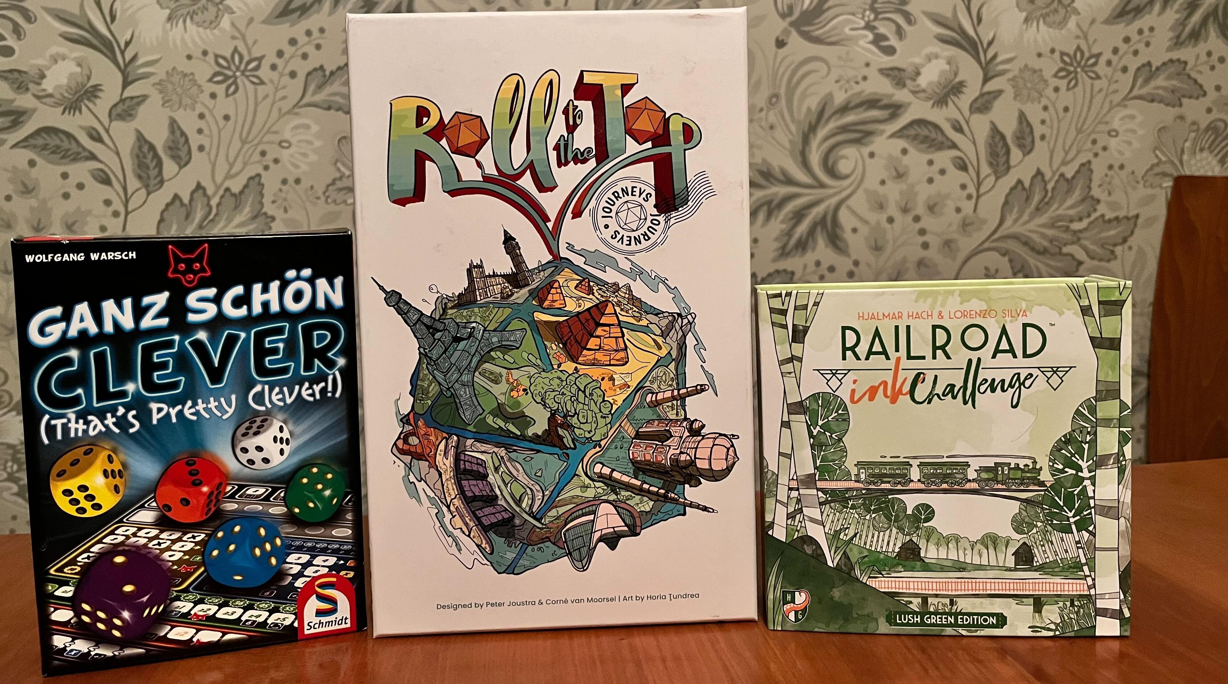  3 spillbokser: "That's Pretty Clever", "Roll to the Top Journeys" og "Railroad Ink Green edition"