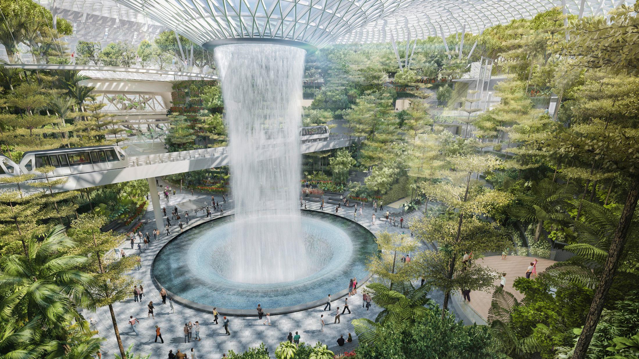 FOSSEFALL: I midten av Jewel i Singapore vil det være både en liten «skog» og et fossefall. Foto: Jewel Changi Airport