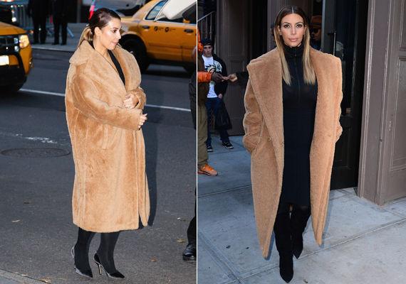 BRUN FAVORITT: Den pusete kåpen i ulike ullmaterialer fra Max Mara har blitt en favoritt hos Kardashian, og hun bruker den ofte til ellers helsorte antrekk. Kåpen har en prislapp på 13.090 kroner hos ulike nettbutikker. Foto: Getty Images/ All Over Press